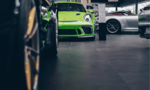 green porsche at exotic car dealership that can be financed by woodside credit