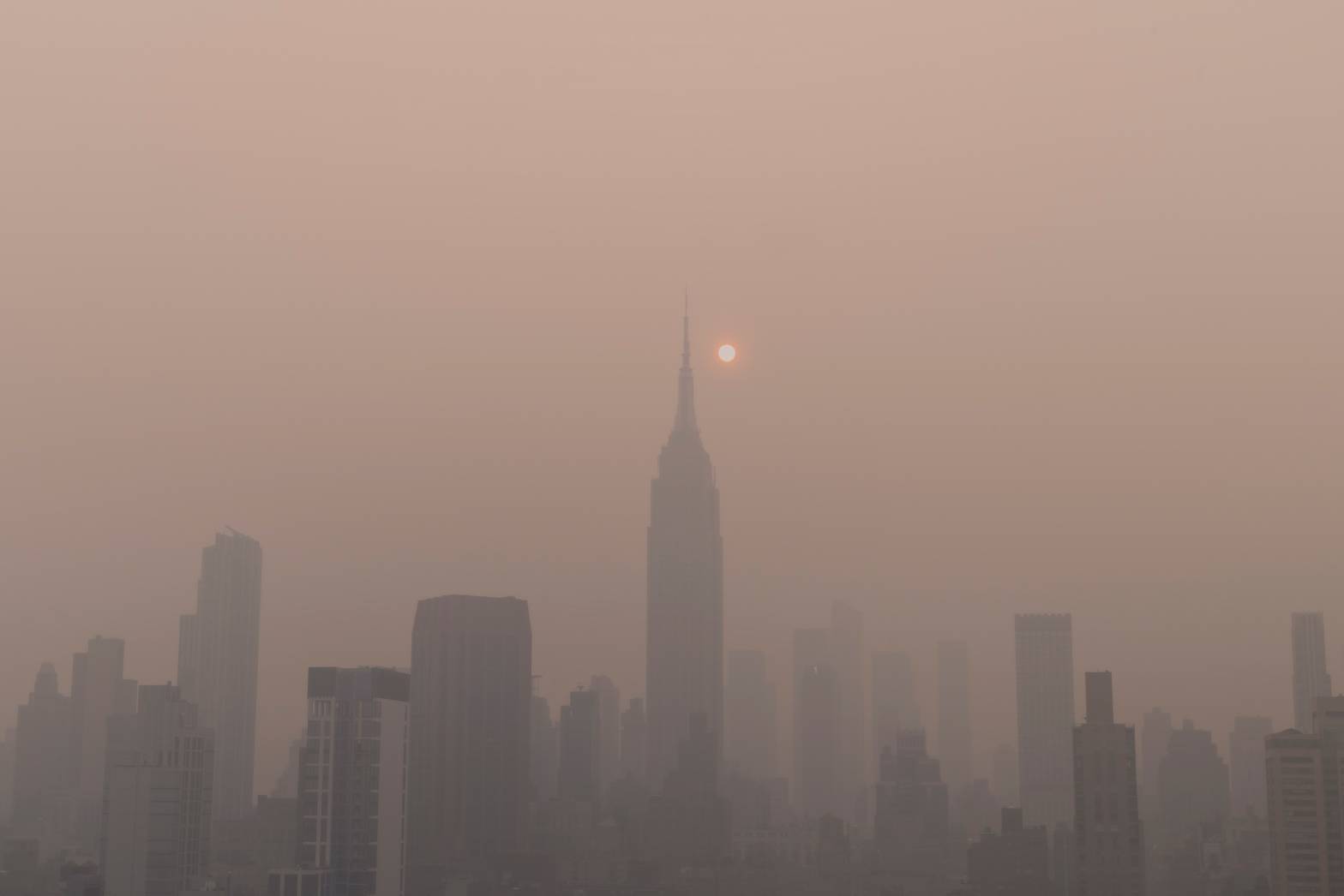 New york city skyline with air pollution due to fires