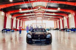Black exotic Porsche in garage