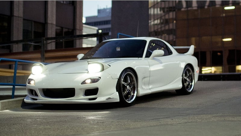 Mazda RX-7 headlights on driving in city