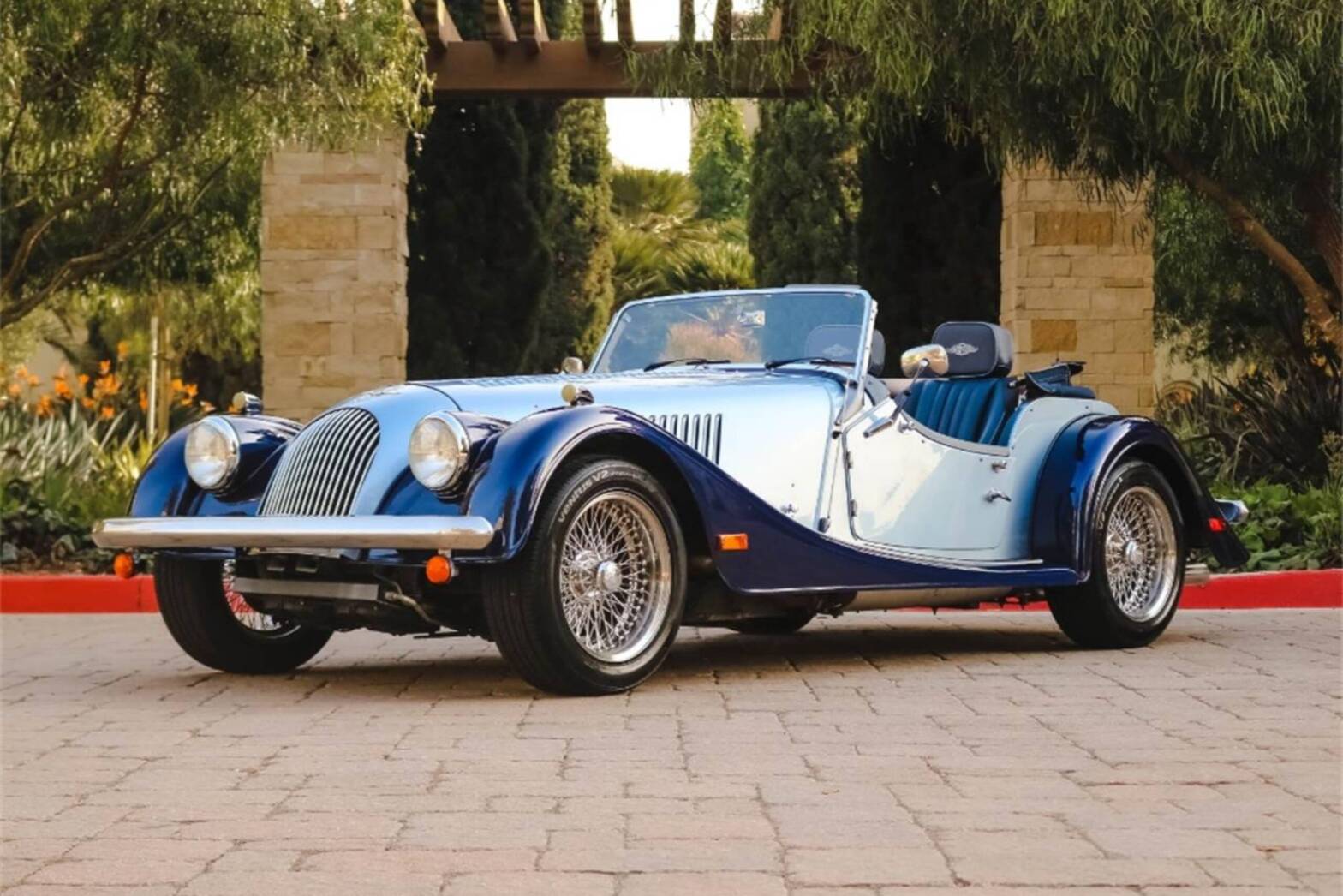 2005 Morgan Roadster in dual color blue parked in front of building