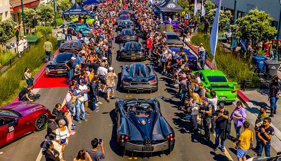 A line of exotic cars and spectators at the Exotics on Broadway show in Monterey CA