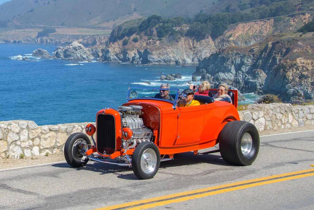 Classic car driving across the picturesque the 17-mile drive in Monterey, California