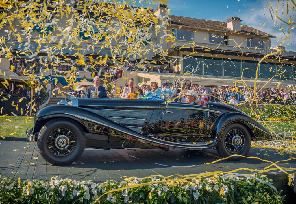 Confetti and classic car on the stage at Pebble Beach Concours d'Elegance