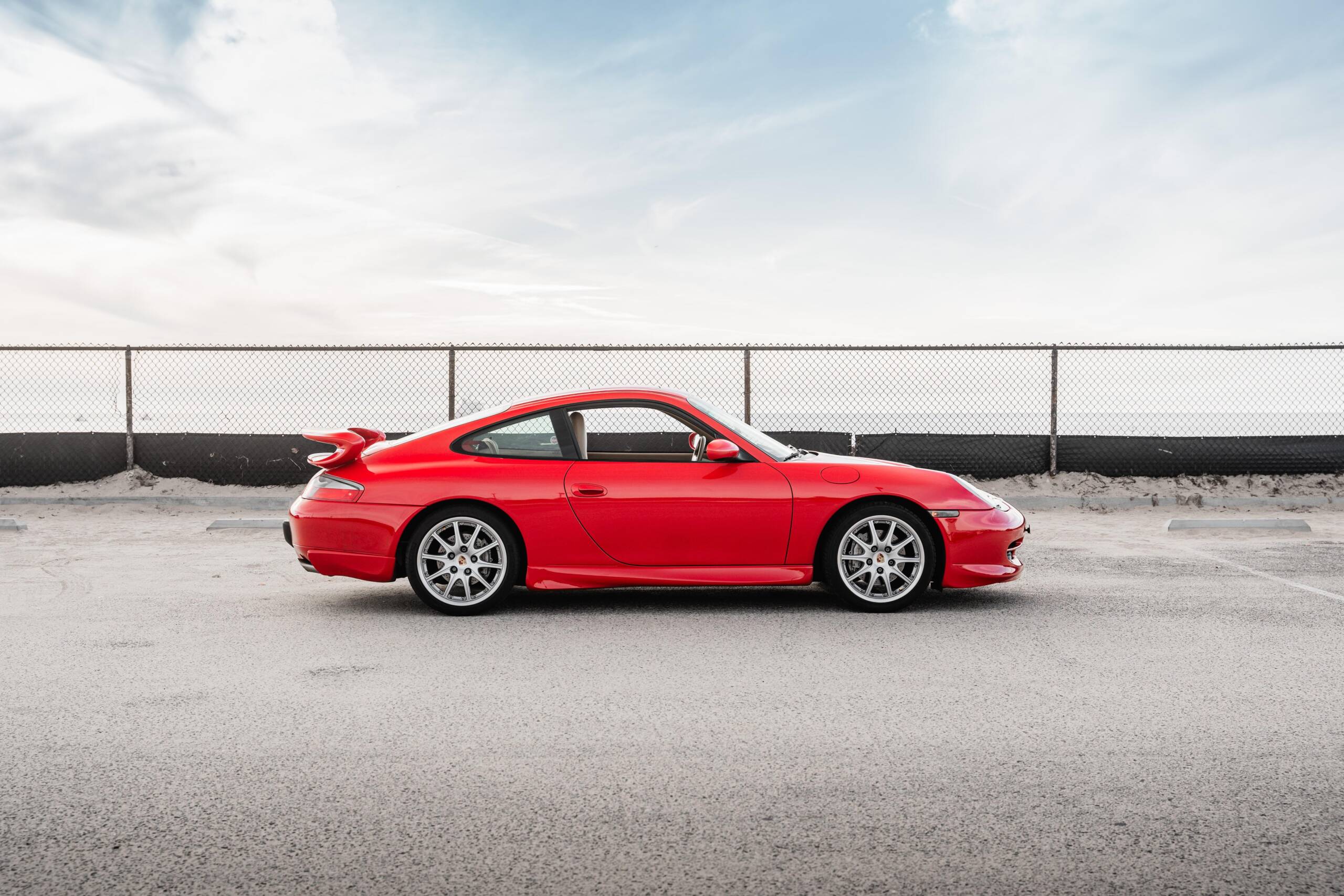 Red Porsche 911 GT3 with rear wing