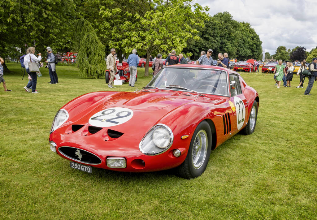 Red ferrari 250 GT on the showfield green