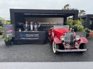 Woodside Credit display with 1933 Packard at Pebble Beach Concours d'Elegance 2024