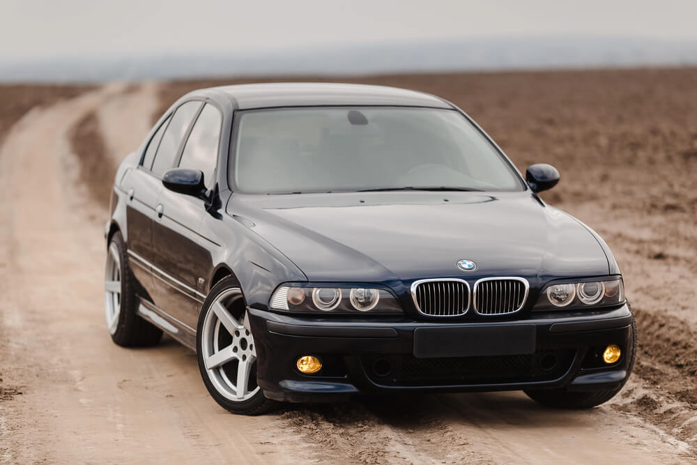 BMW M5 E39 classic car in the dirt