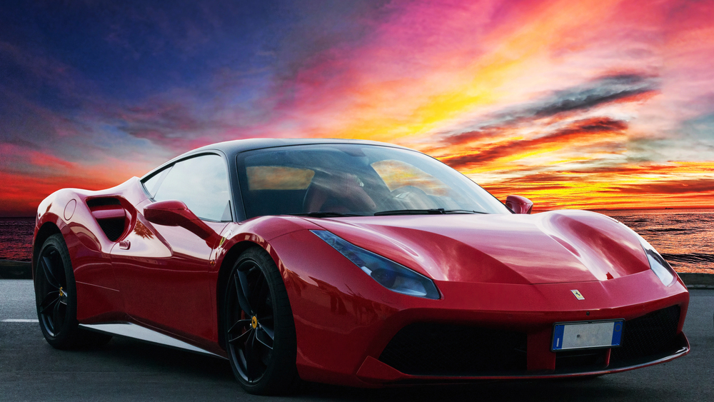 Beautiful red ferrari at sunset