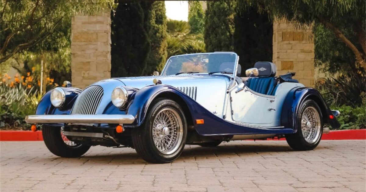 2005 Morgan Roadster in dual color blue parked in front of building