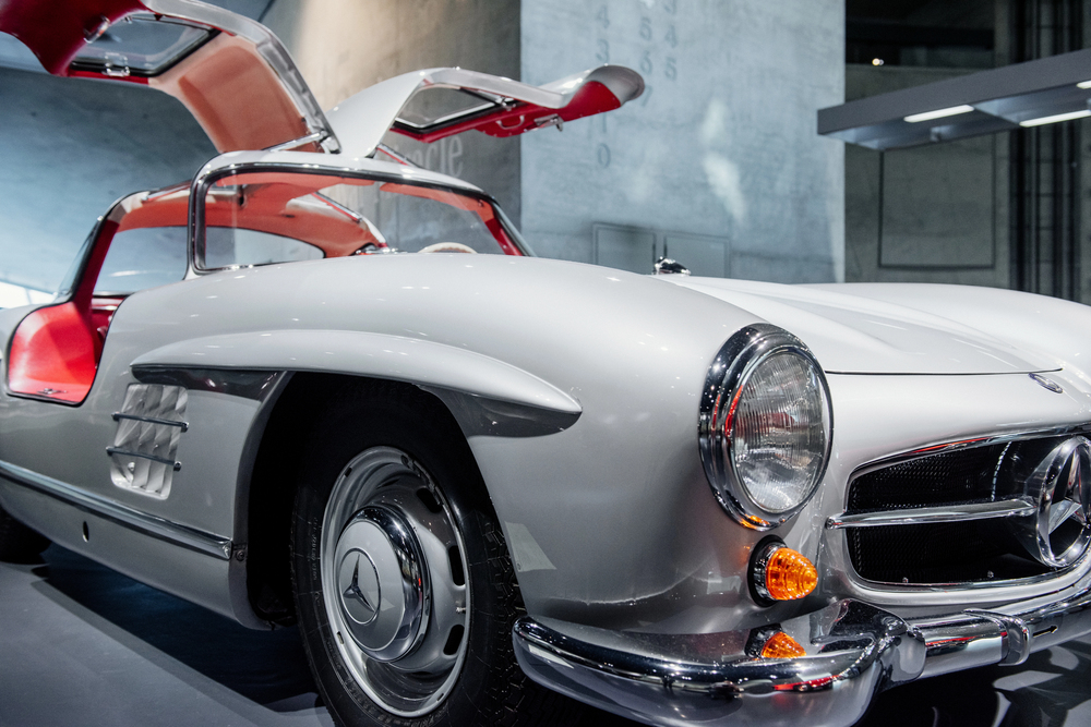 Silver Mercedes-Benz 300SL Gullwing retro classic car with red interior
