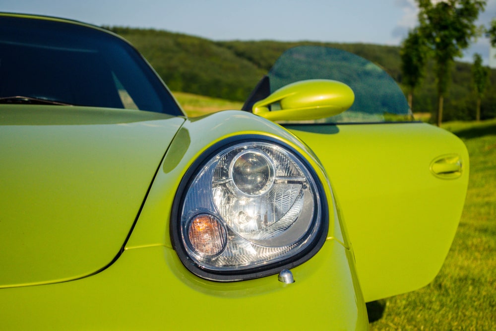 Green Porsche with door open
