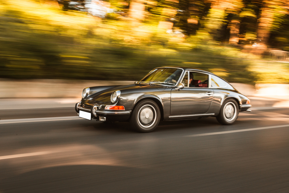 A classic old fashioned Porsche on the forest road
