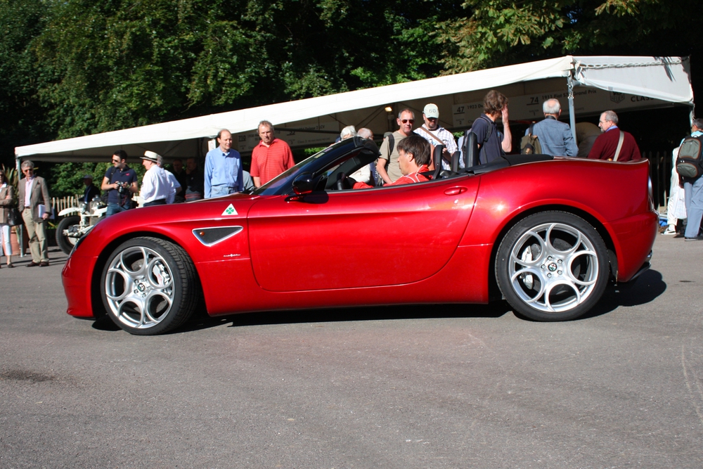 Red Alfa Romeo 8C at a car show