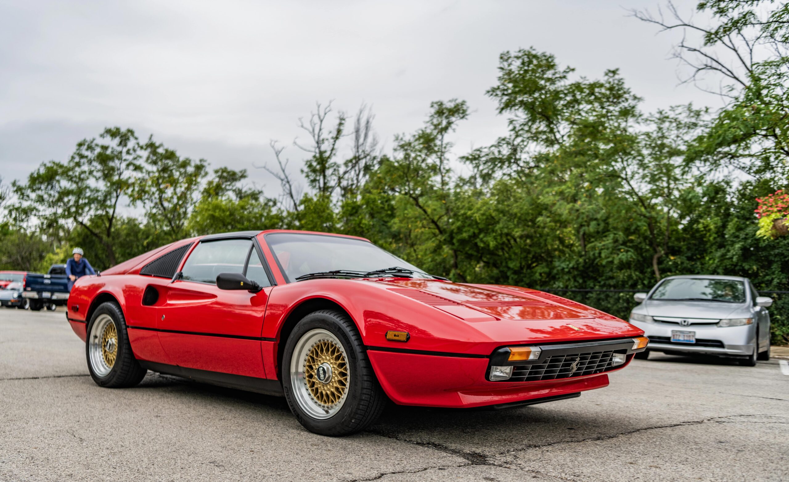 Red Ferrari 308 in parking lot