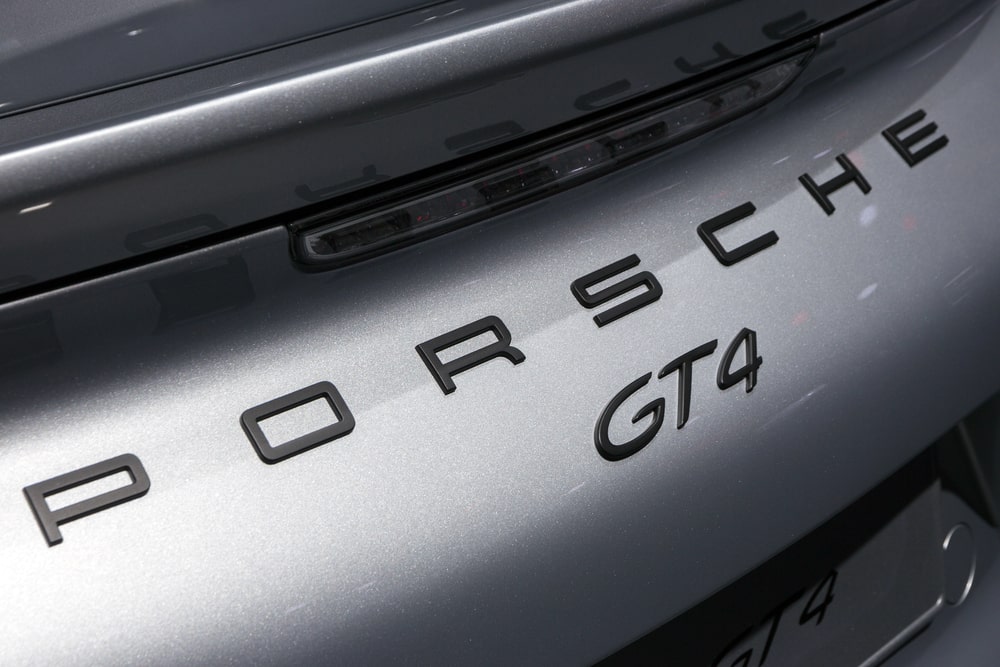 Tailend of a silver Porsche GT4