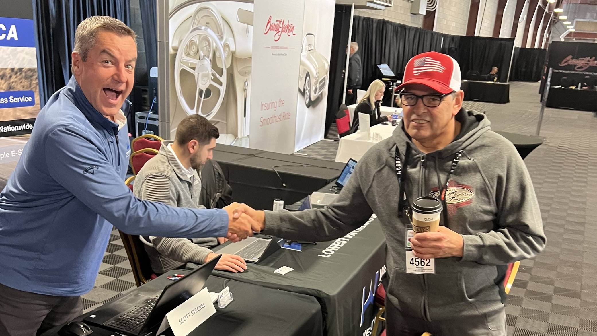 scott-steckel-shaking-hands-with-Woodside-Credit-client-barrett-jackson
