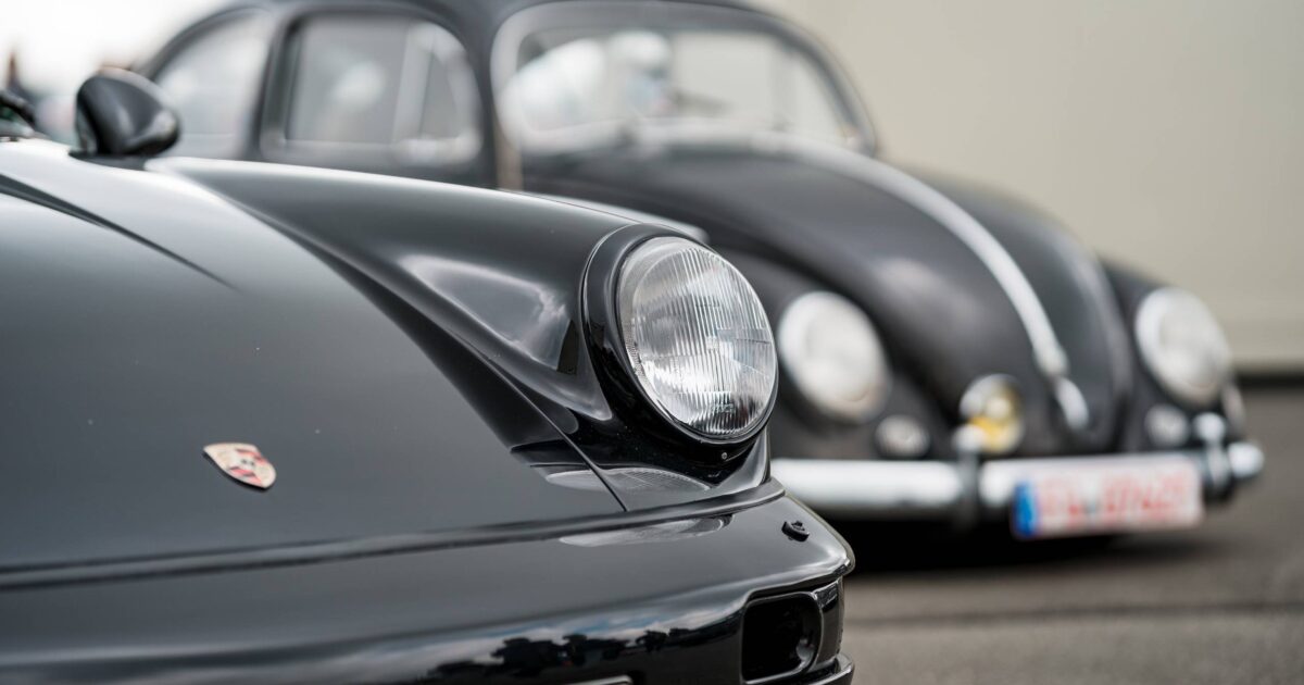 black Porsche 911 and volkswagen beetle