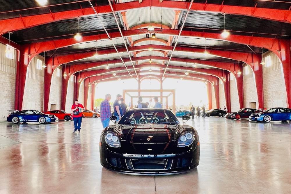 Black exotic Porsche in garage