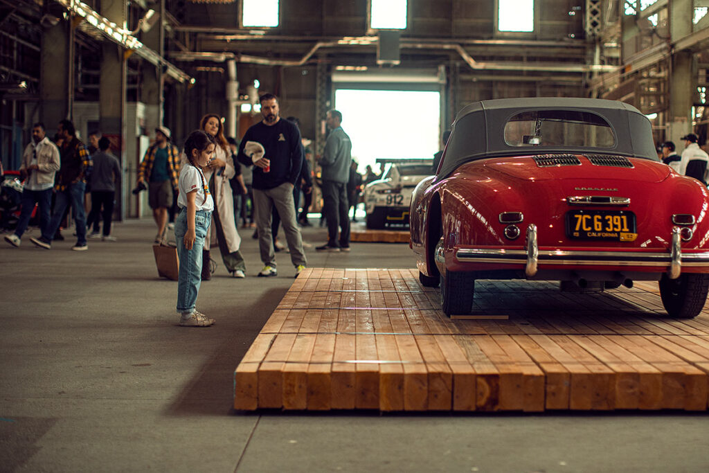 Spectators at the Air Water Porsche event looking at a classic Porsche