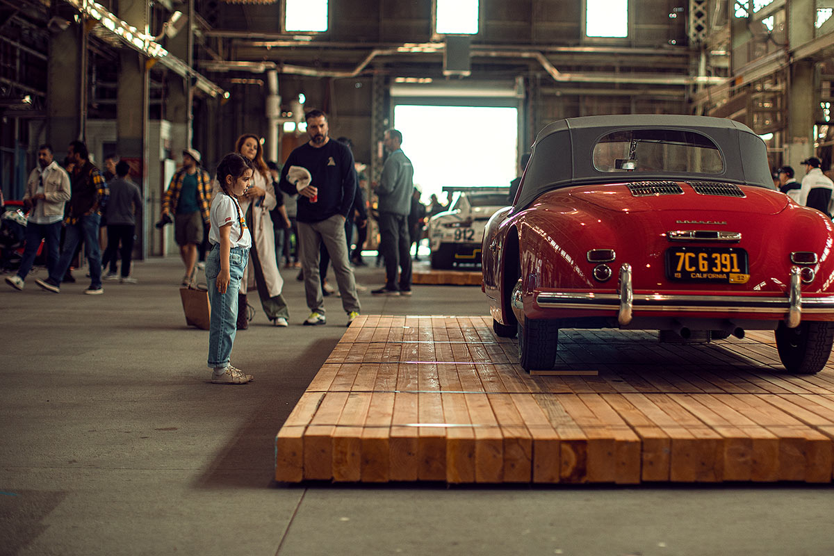 Spectators at the Air Water Porsche event looking at a classic Porsche