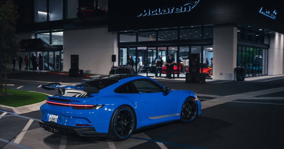 Blue porsche 911 outside of dealership