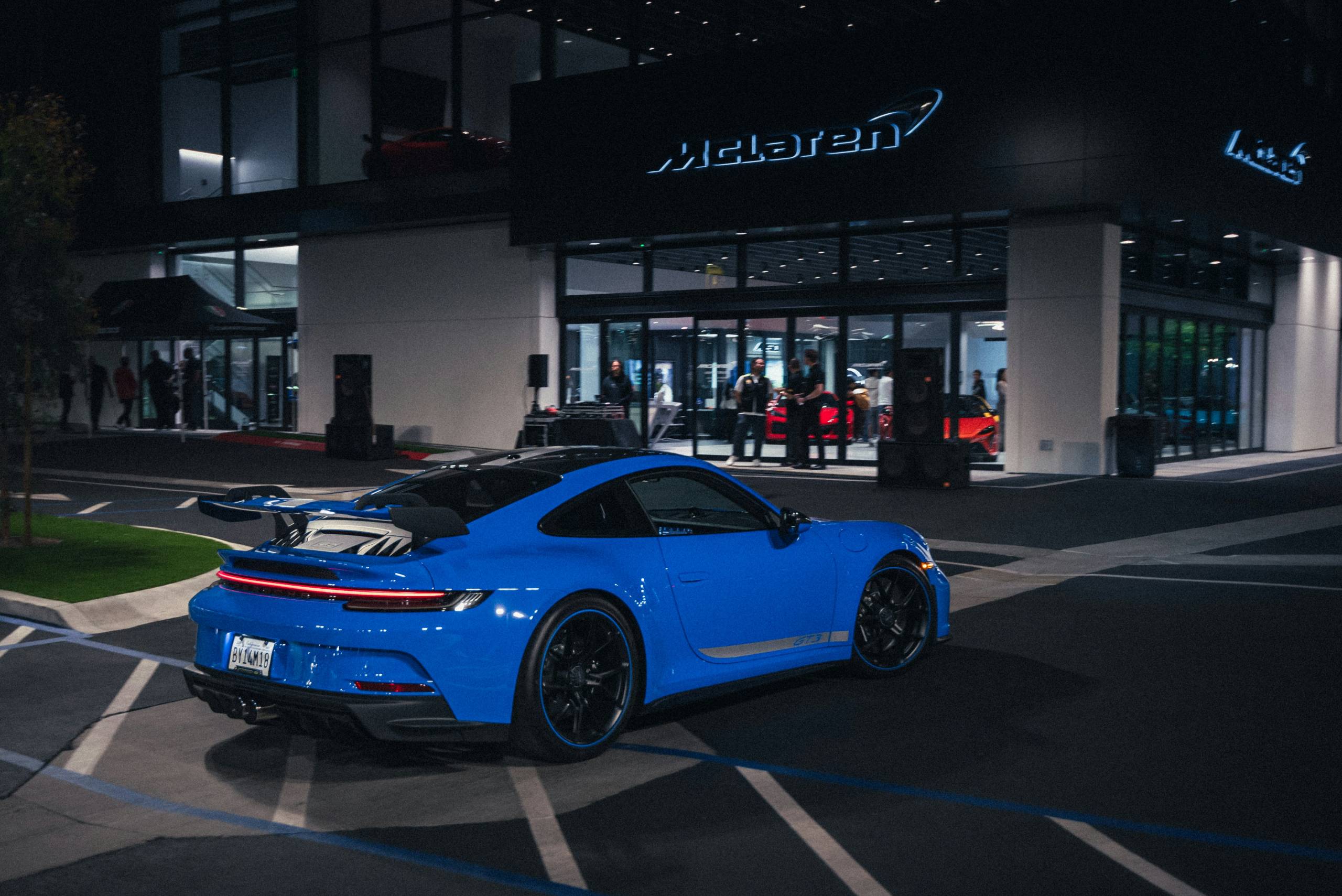 Blue porsche 911 outside of dealership