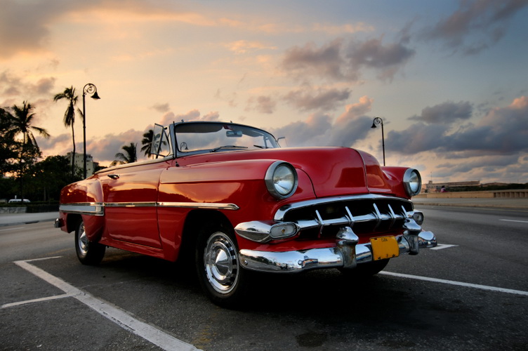 Red car in Havana sunset