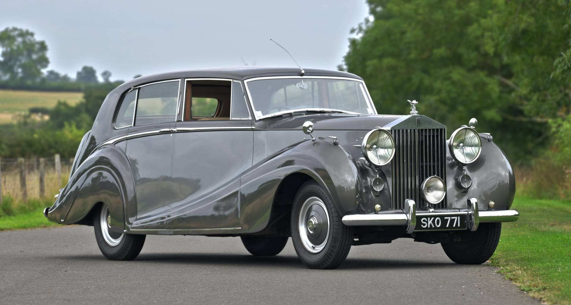 Grey Rolls-Royce Silver Wraith photographed in front of a vineyard